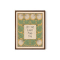 May include: Framed art print with a botanical design. The artwork features a central text box with the words "Let the Light Find You" in a stylized font. The border includes green leaves, white flowers, and a yellow background. The frame is a dark brown color.