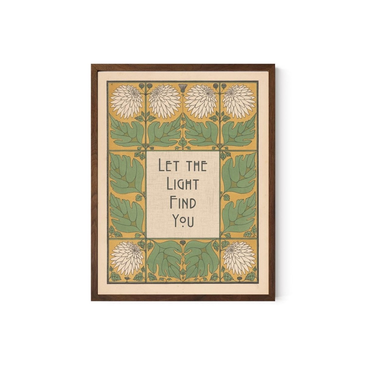 May include: Framed art print with a botanical design. The artwork features a central text box with the words "Let the Light Find You" in a stylized font. The border includes green leaves, white flowers, and a yellow background. The frame is a dark brown color.