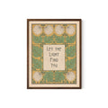 May include: Framed art print with a botanical design. The artwork features a central text box with the words "Let the Light Find You" in a stylized font. The border includes green leaves, white flowers, and a yellow background. The frame is a dark brown color.