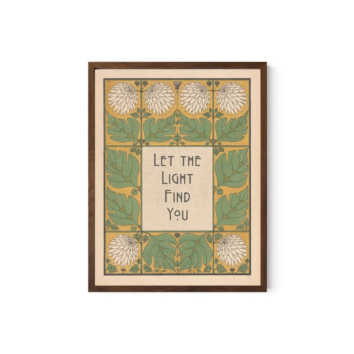 May include: Framed art print with a botanical design. The artwork features a central text box with the words "Let the Light Find You" in a stylized font. The border includes green leaves, white flowers, and a yellow background. The frame is a dark brown color.